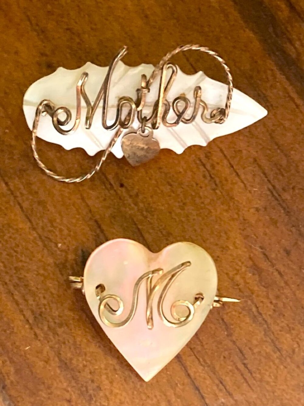 Pair of antique mother of pearl brooches